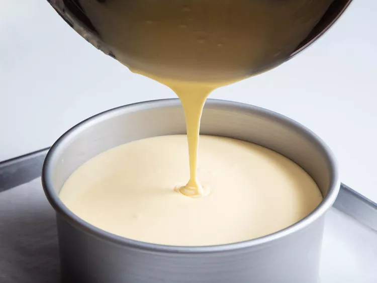 Smooth cheesecake batter being poured